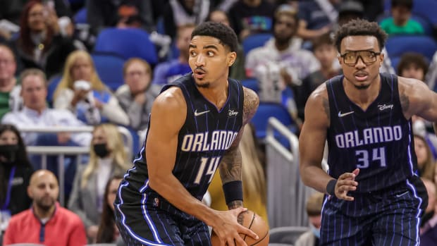 Jan 28, 2022; Orlando, Florida, USA; Orlando Magic guard Gary Harris (14) grabs the rebound and looks to pass against the Detroit Pistons during the second half at Amway Center.